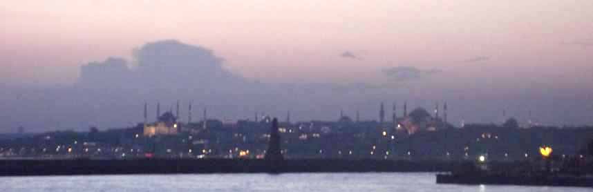 At sunset, the Istanbul skyline silhouttes the minarets of its many mosques